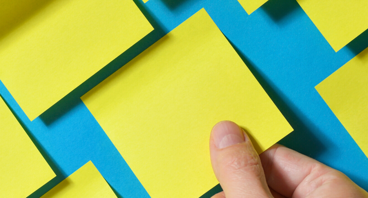 Several yellow sticky notes on a blue background