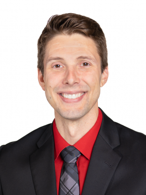 A professional headshot of John Fritzke, presenting a confident and approachable appearance.